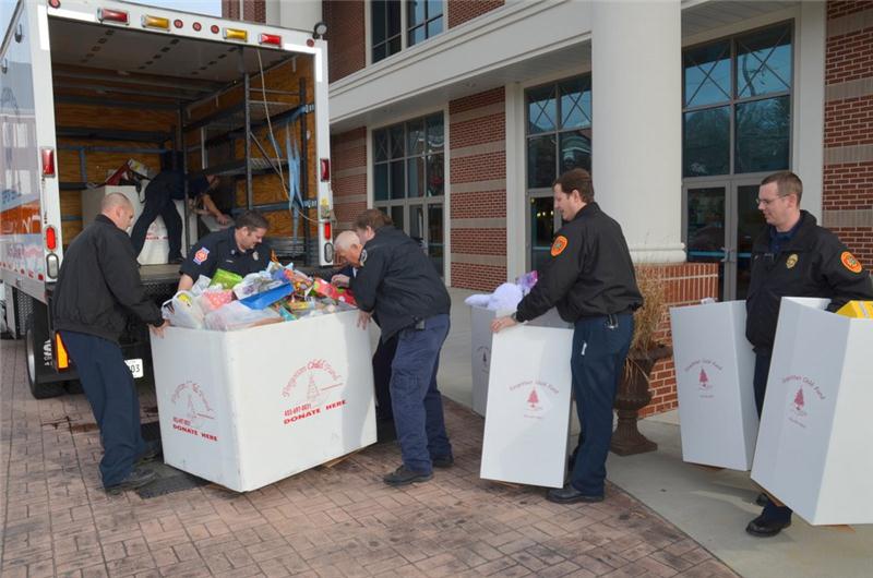 officers collecting donation boxes