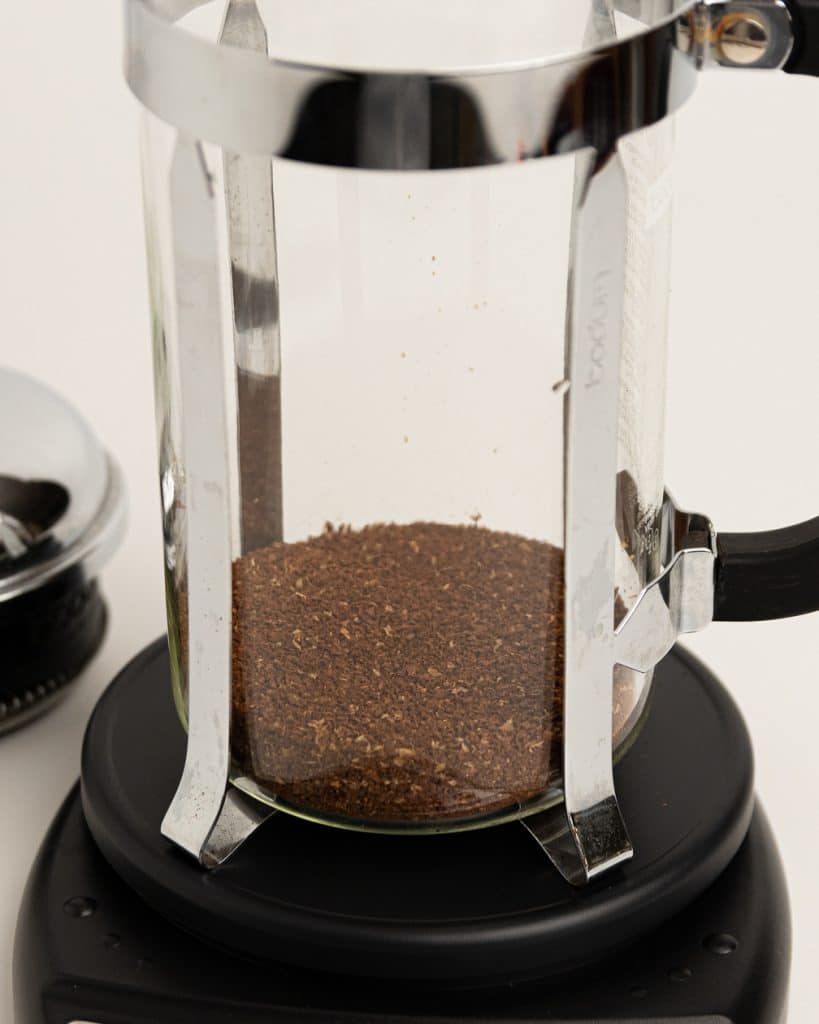 grounds in the bottom of a French press base