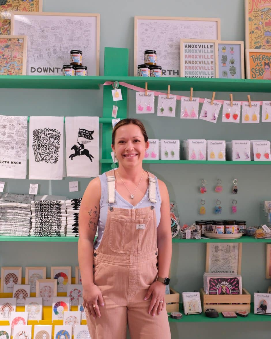 Artist Paris Woodhull stands in front of a display in her shop in Knoxville, TN.