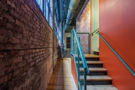 Image of the back wall of Frothy Monkey in Knoxville that looks out into Strong Alley. (Image by Randy Sartin)